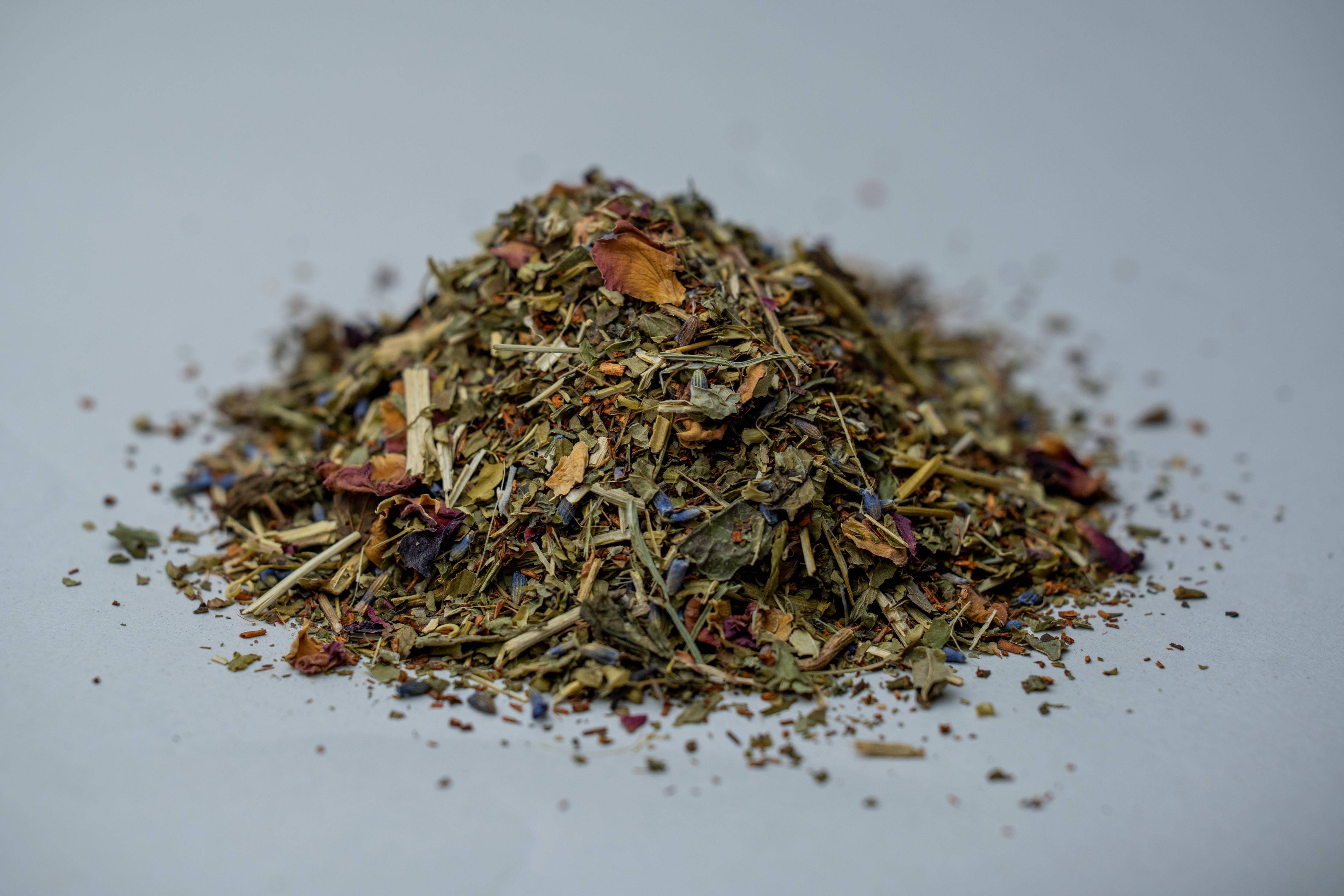 Zabelia Evening Unwind Calming Rooibos herbal tea with dried herbs and botanicals in a tea blend, ready for brewing.