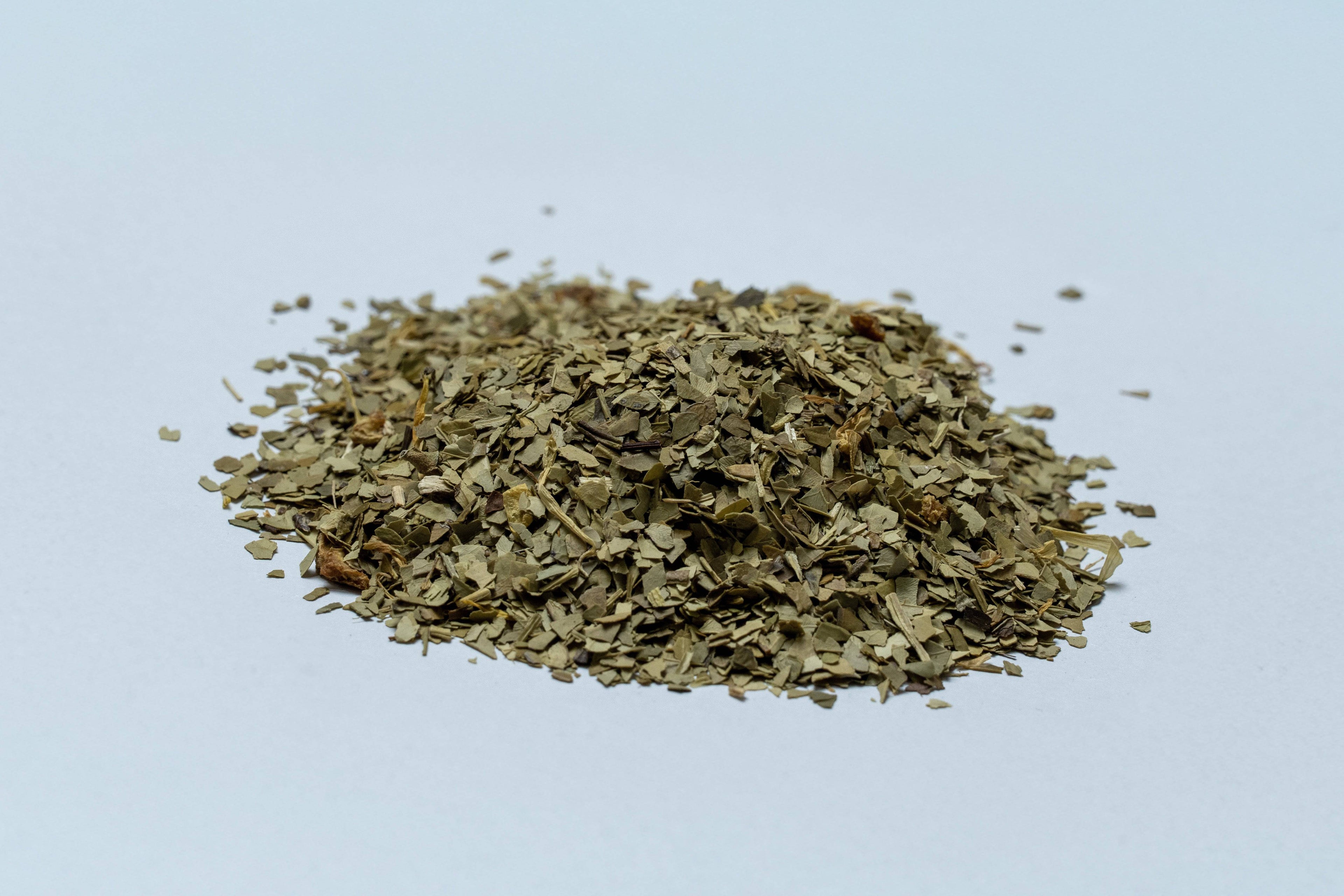 Focus Flow energizing yerba mate tea blend from Zabelia Wellness with visible dried yerba mate leaves, herbs, and natural ingredients.