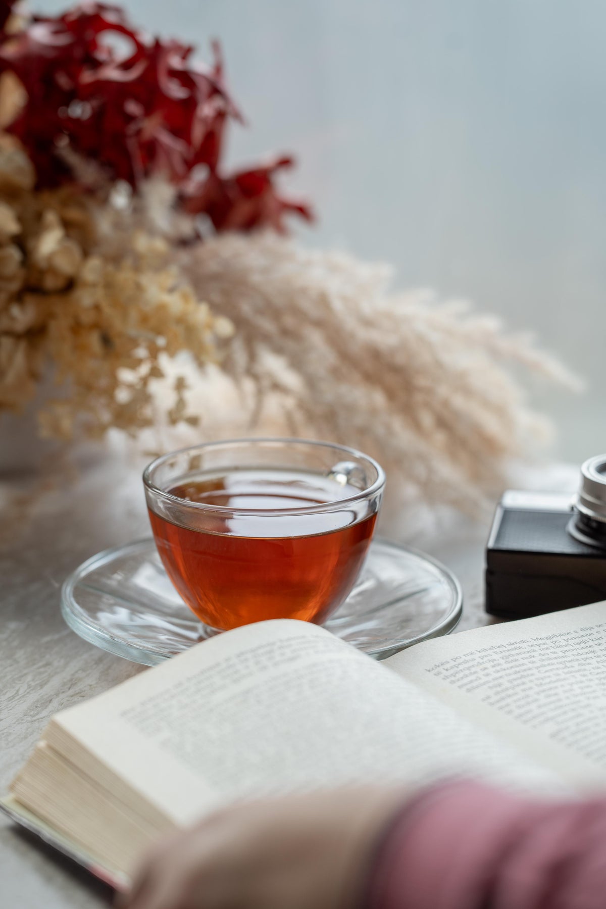 Cup of Evening Unwind tea and cozy setup, showing a relaxing tea ritual